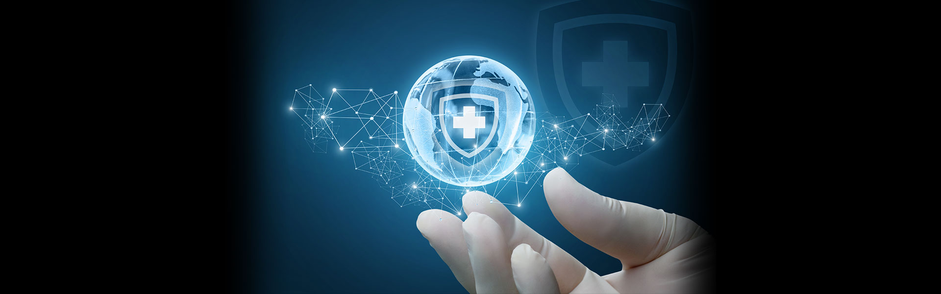 hand holding floating world with shield overlaid representing healthcare security