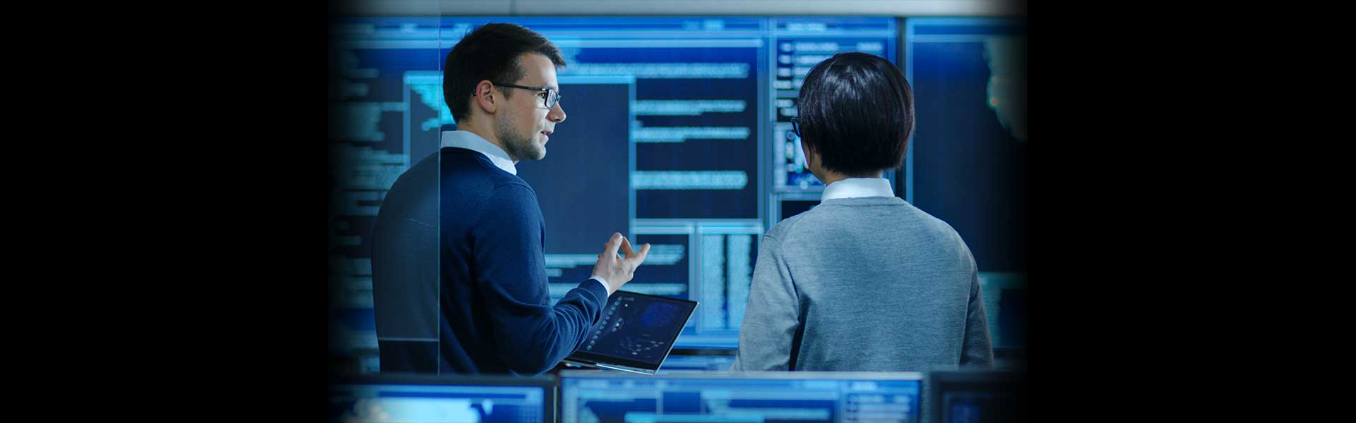 two people talking in cyber security room